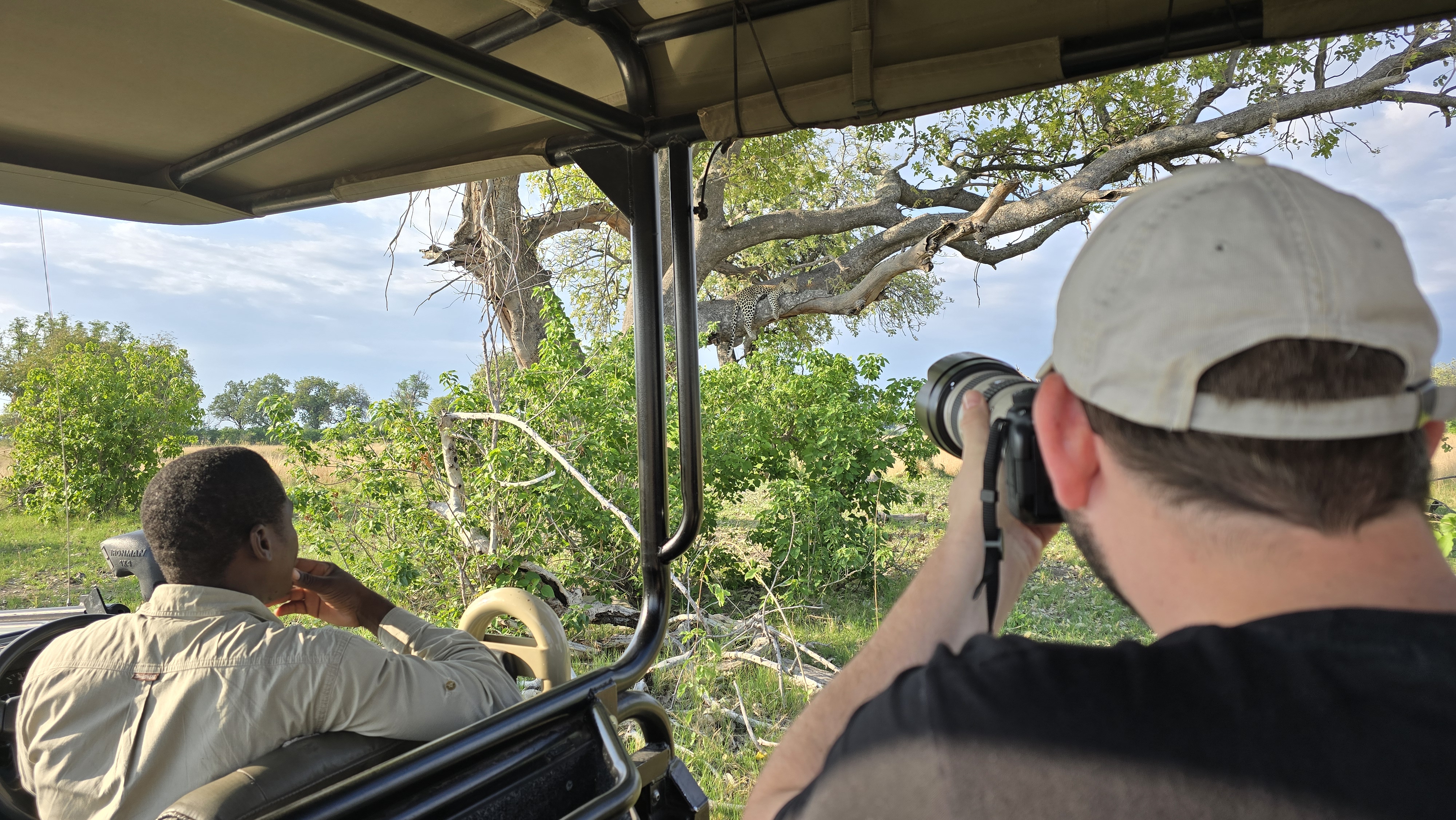 Safari guests with a guide in the Okavango Delta
